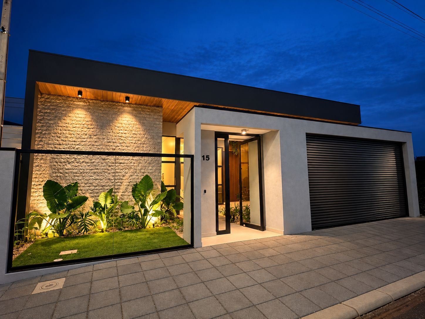 Residência Tropical 4 · 01 concluída, fachada iluminada à noite